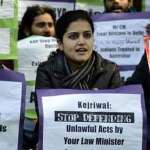 Protesters demand resignation of Delhi Law Minister Somnath Bharti for defaming African women in Delhi.