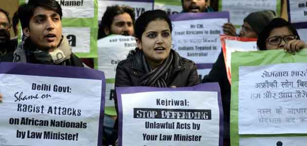 Protesters demand resignation of Delhi Law Minister Somnath Bharti for defaming African women in Delhi.