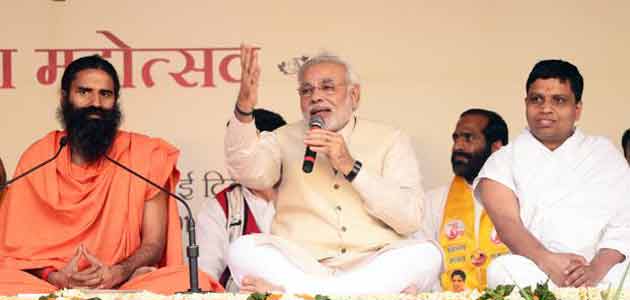 Modi took on Congress leaders at the yoga event for targeting Ramdev.