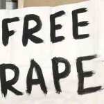 A woman shows a poster in a demonstration against rapes.