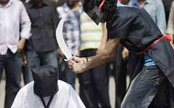 Symbolic photo: Militants moments before beheading a man.