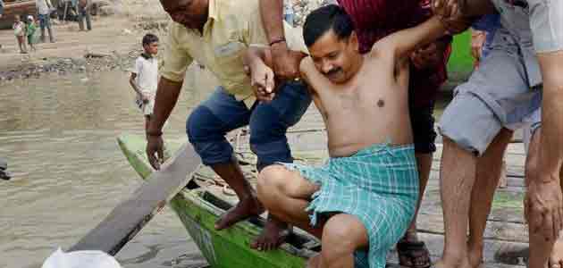 AAP chief Arvind Kejriwal takes a holy dip as he arrives in Varanasi.