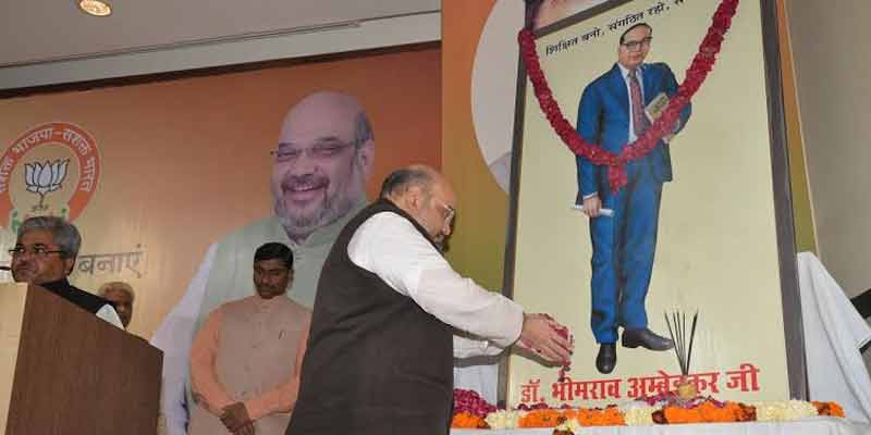BJP chief Amit Shah paysfloral tribute to late Dr B R Ambedkar.